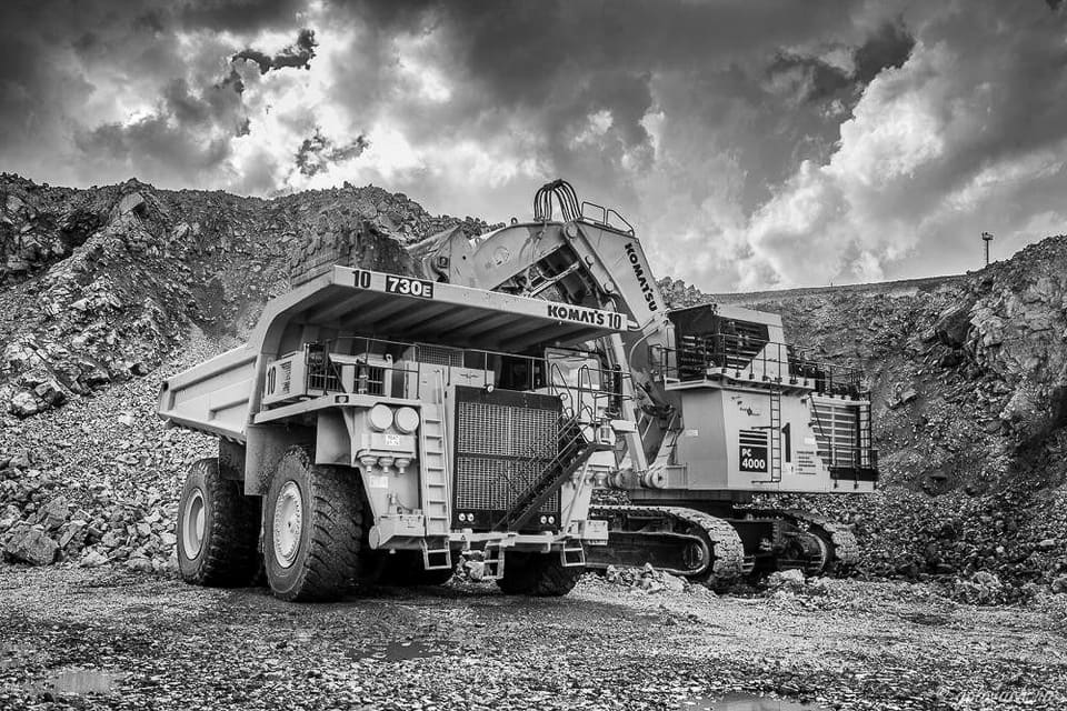 Komatsu haul truck and excavator on a quarry floor